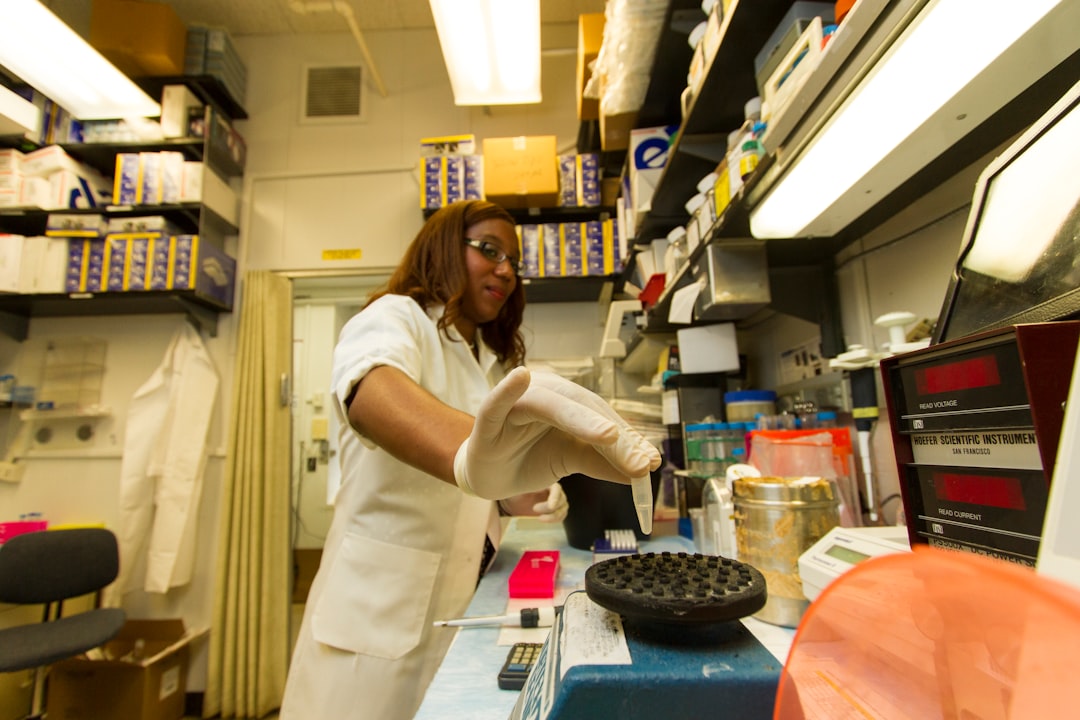 A professional laboratory setting where a technician is testing samples of grains for quality assurance